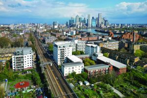 East-London-housing-Canary-Wharf-in-bg-shutterstock_2501465769-starlings_images-scaled-e1727271639126-300x200.jpg