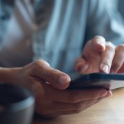 Closeup of a woman's hands using a smartphone