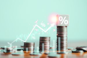 An image of piles of coins overlaid with graphs.